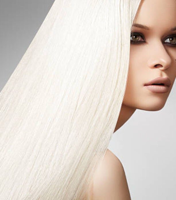 Well-being & spa. Sensual woman model with shiny straight long blond hair and chic evening make-up. Health, beauty, wellness, haircare, cosmetics and make-up. Beautiful fashion platinum hairstyle